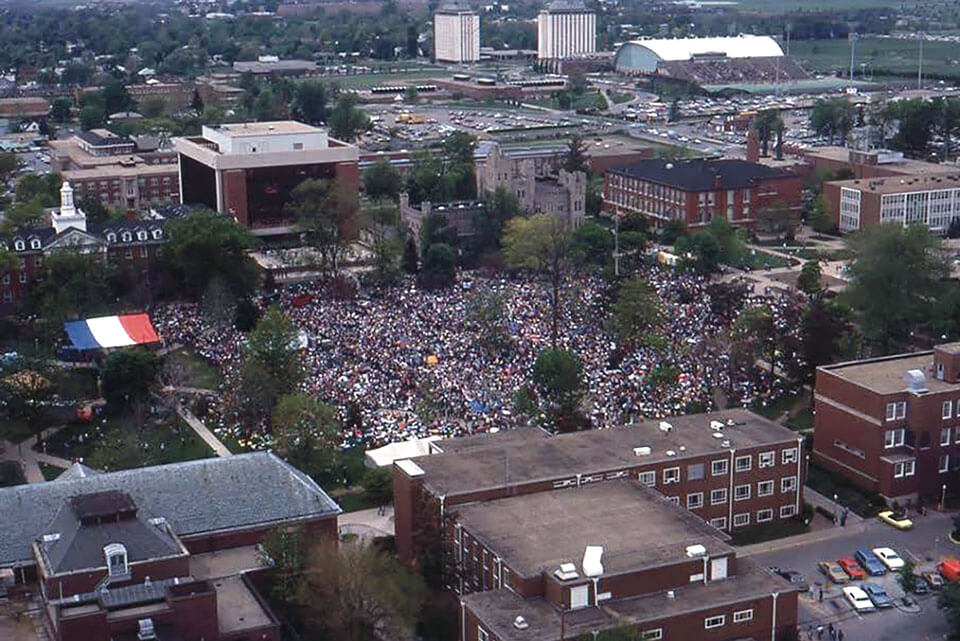 An aerial shot of campus covered in a large crowd during the Rites of Spring.