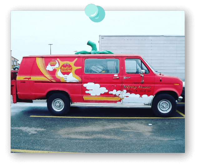 A Garcia's delivery van that's decorated like a tomato.