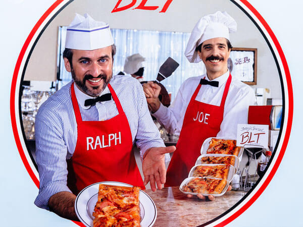 A photo of Ralph and Joe dressed as chefs.