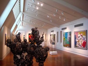 Several paintings and sculptures on display at the Portland Art Museum.