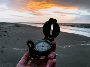 Compass on a beach
