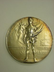 Olympic gold medal, Antwerp 1920, designed by Josue Dupon (from Wikimedia, click to enlarge)