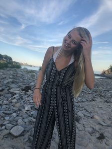 Megan Shaffer standing on a rocky shore